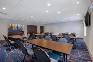 a conference room with tables and chairs and a podium at Hampton Inn & Suites Harvey New Orleans Westbank in Harvey +36 photos