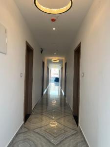 a hallway of a building with a chandelier at ishika grand in Secunderabad