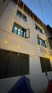 a building with christmas lights hanging from it at Maa Buu Chhen in Pātan