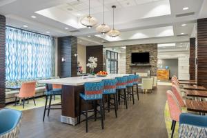 a large dining room with a large table and chairs at Hampton Inn by Hilton Winnipeg in Winnipeg