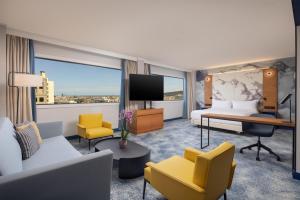 a hotel room with a bed and a tv at Hilton Barcelona in Barcelona