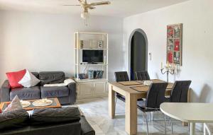 a living room with a couch and a table at 2 Bedroom Lovely Apartment In Estepona in Estepona