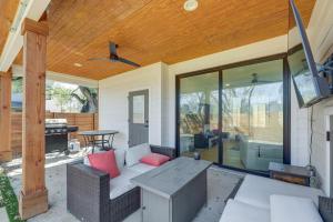 a screened porch with a couch and a table at Chic Austin House w/ Spacious Backyard & Hammock in Austin