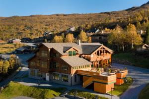 an aerial view of a house with a mountain in the background at Filefjellstuene Hotel in Tyinkrysset
