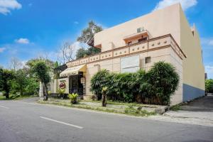 a building on the side of a street at Collection O near University of Sumatera Utara formerly Huber Apartment in Medan