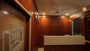 a room with a wooden wall with a ceiling at Bekal Gate Residency in Kotikulam