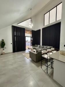 a living room with a couch and a table at EHH Accommodation Hentiesbay in Hentiesbaai