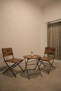 two chairs and a table and a table and chairs at JD Tara Resort in Ranakpur