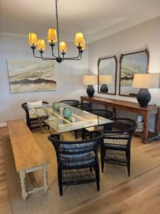 a dining room with a table and chairs at Dornoch House, Gowrie Village in Nottingham Road