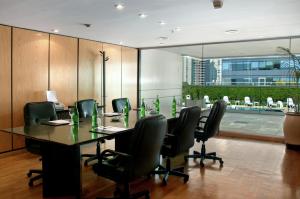a conference room with a long table and chairs at Hilton Buenos Aires in Buenos Aires +54 photos