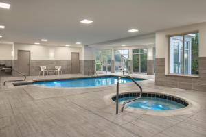 a swimming pool in a large room with at Hilton Garden Inn Wooster in Wooster