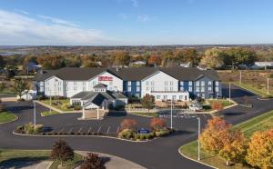 an aerial view of a hotel with a parking lot at Hilton Garden Inn Wooster in Wooster