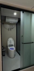 a small bathroom with a toilet and a sink at Kolsay tany in Kurmenty