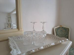 two clear glasses sitting on top of a table at La casa nel borgo in Cavaso del Tomba