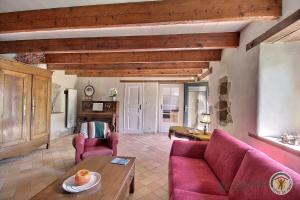 a living room with a couch and a table at Kerguntuil in Pleumeur-Bodou