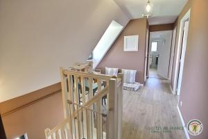a hallway with a staircase in a house at Villa caroline in Trébeurden +68 photos