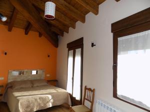 מיטה או מיטות בחדר ב-Casas Rurales las Eras III