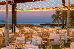 a wedding reception at the beach with tables and chairs at Hilton Cartagena in Cartagena de Indias +133 photos