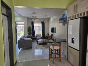 a living room with a couch and a table at T&M Estates Lusaka in Chilanga