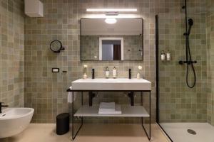 a bathroom with a sink and a mirror at Heritage Hotel Lucia in Dubrovnik +78 photos