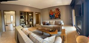 a living room with two couches and a fireplace at villa Bidouane in Marrakesh