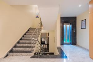 a staircase in a house with a stair case at Treebo Grace Stays in Bhubaneshwar