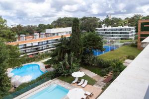 an aerial view of a hotel with a swimming pool at Oceana Suites Mansa Inn in Punta del Este
