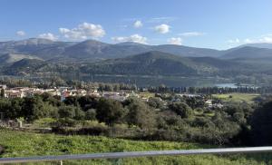 a view of a town with a lake and mountains at 360 Skyline Suite, Argostoli in Argostoli