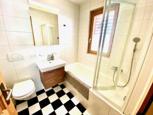 a bathroom with a sink toilet and a shower at Le Charme 1, Morgins in Morgins +7 photos