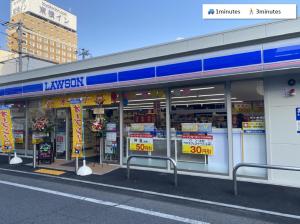 a store front of a store with signs in the windows at ura アオトハル2 in Okayama