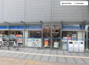 a large building with a law store with machines at ura 東横のヨコ in Okayama