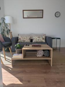 a living room with a couch and a coffee table at Trim private rooms in Trim