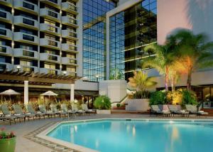 a swimming pool in front of a hotel at DoubleTree by Hilton San Jose in San Jose