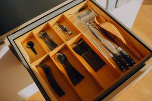 a wooden cabinet with a bunch of ties in it at cabinski Montafon in Sankt Gallenkirch