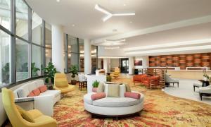 a lobby with couches and chairs on a rug at DoubleTree Suites by Hilton Phoenix in Phoenix +56 photos
