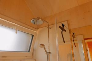 a bathroom with a shower with stars on the ceiling at cabinski Montafon in Sankt Gallenkirch +6 photos