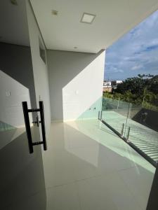 a room with a view of a tennis court at Mansão Duplex Santarém in Santarém