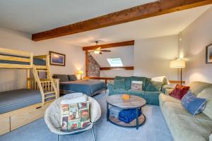 a living room with a couch and a bunk bed at Spacious Bartlett Condo w/ Balconies & Pool! in Bartlett +32 photos