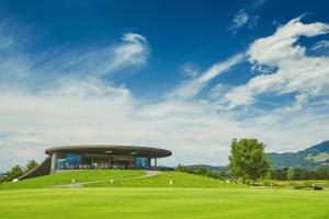 a building on top of a lush green field at S'Matt Bob in Feldkirch