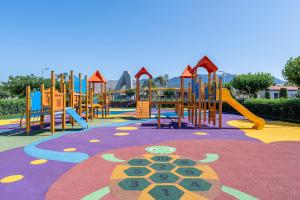 a playground with a colorful play area with a slide at Astir Odysseus Kos Resort and Spa in Tigaki
