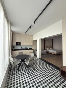 a kitchen and dining room with a table and chairs at Soho Boutique apartments in Ljubljana