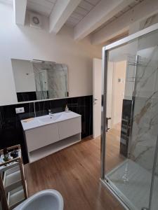 a bathroom with a white sink and a shower at b&b Civico 30 in Lonato +33 photos