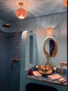 a bathroom with a sink and a mirror at Riad & Spa Stella Cadente Marrakech in Marrakesh +61 photos