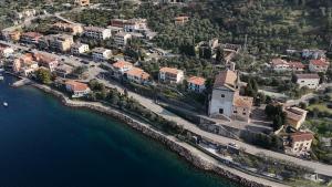 an aerial view of a town next to the water at Sottovento Beths House in Brenzone sul Garda