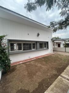 a white building with a lot of windows at Casa Kempes in Córdoba