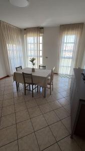 a dining room with a table and chairs at Savi Residence in Savigliano