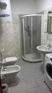 a bathroom with a shower and a toilet and a sink at Savi Residence in Savigliano +10 photos