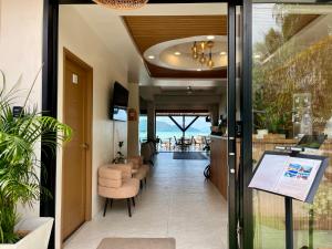 a lobby of a hotel with a view of the ocean at South Beach Inn in Nathon Bay
