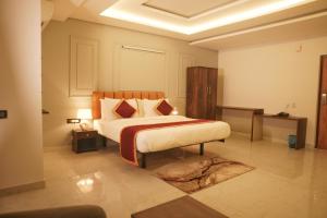 a bedroom with a large bed in a room at Hemagiri Palace in Avati