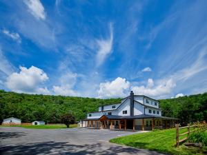 a large white house on the side of a road at Saddleview Bed & Breakfast in South Sterling